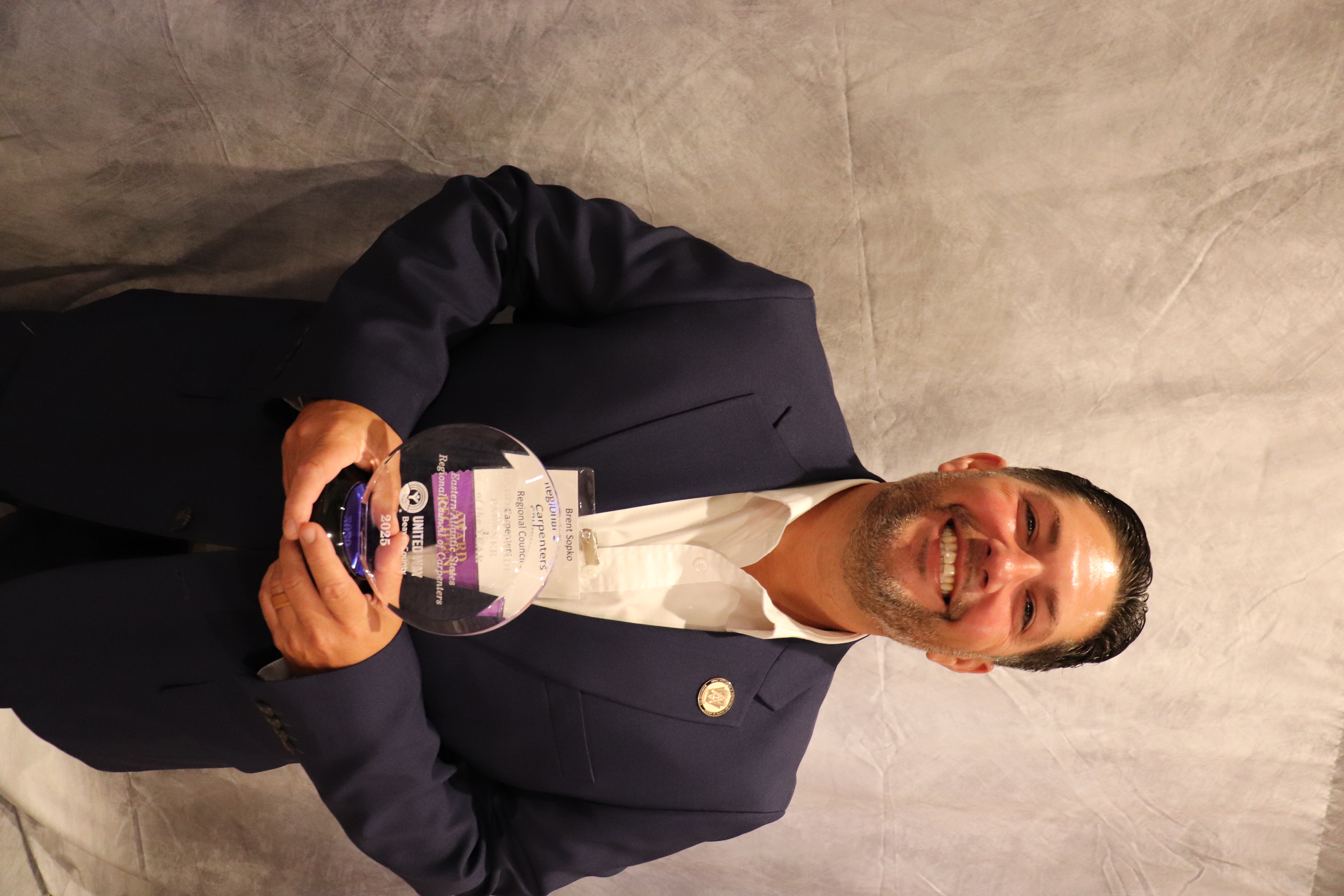 Brent Sopko accepting the LAbor and Trades Award for Eastern Atlantic States Regional Council of Carpenters