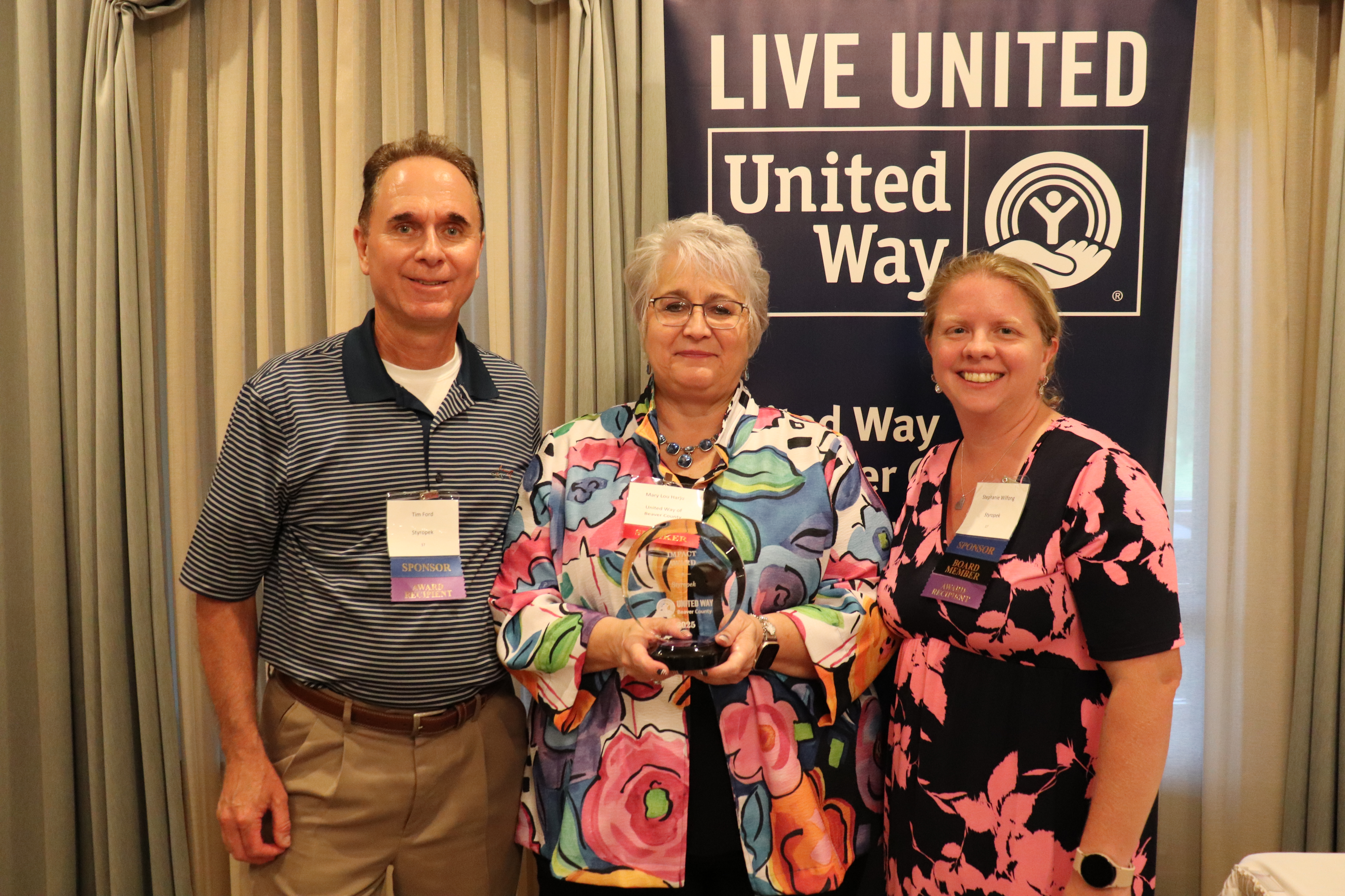 Time Ford and Stephanie Wilfong accepting the Impact Award for Styropek