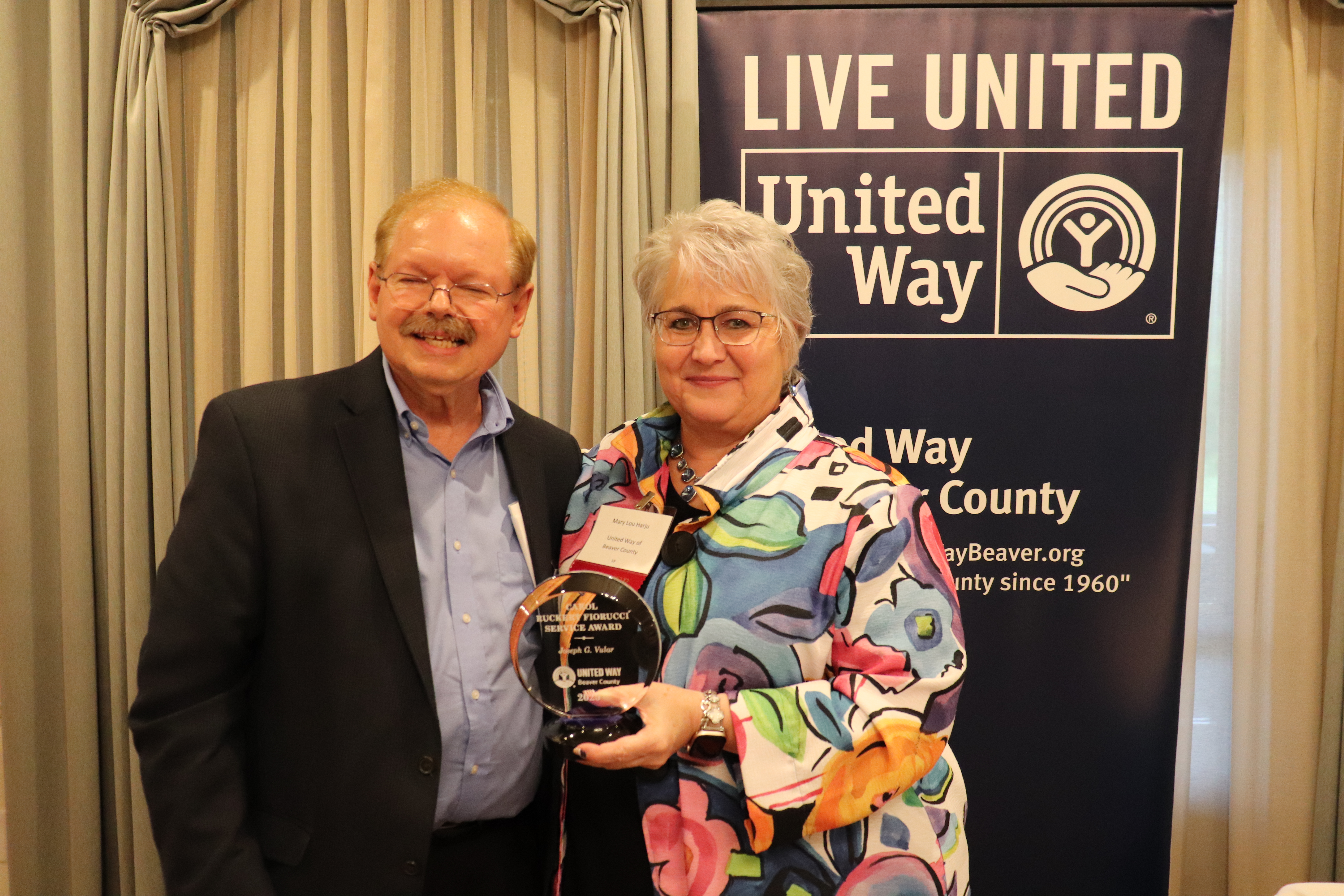 Joseph Vular accepting the Carol Ruckert Fiorucci Service Award