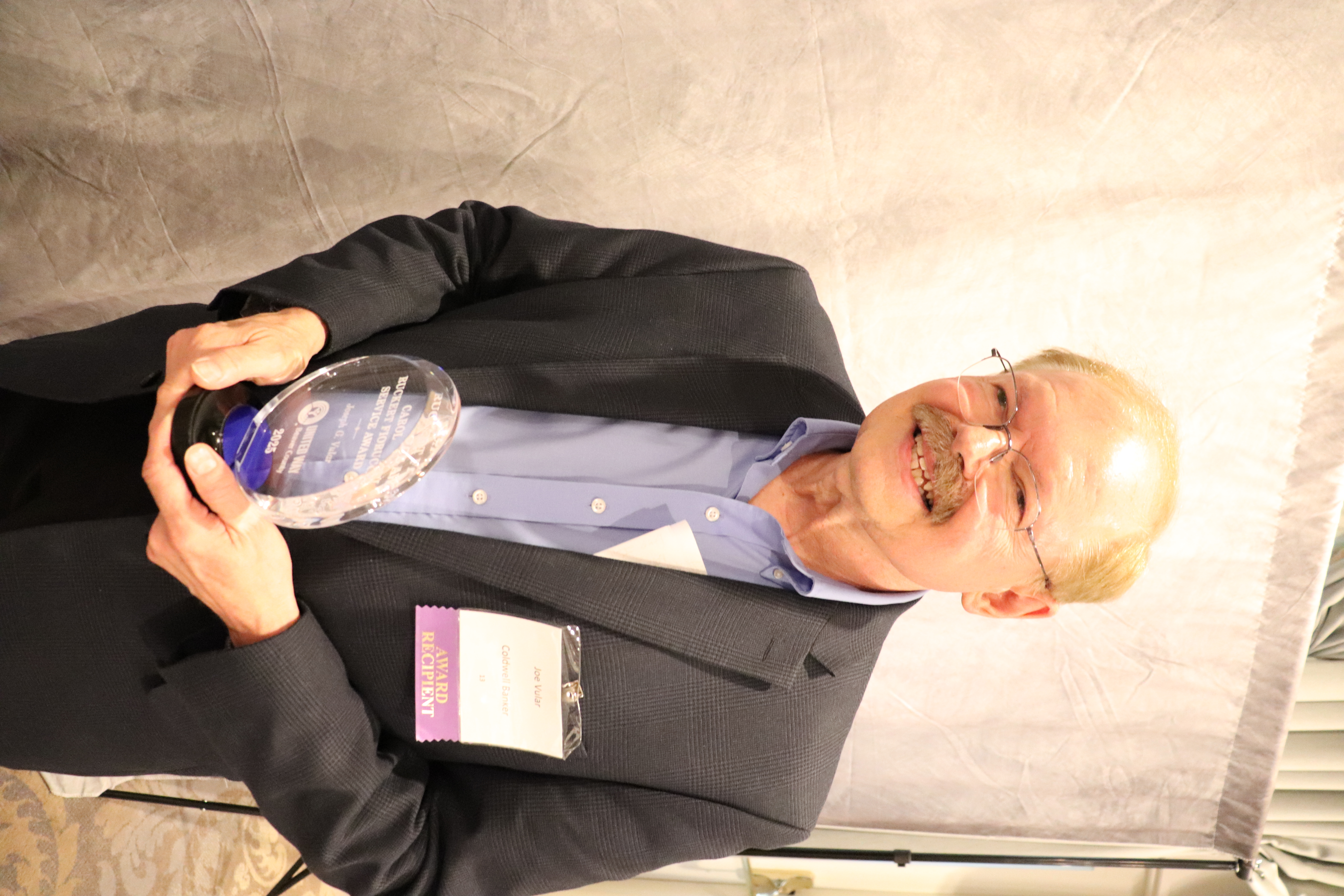 Joseph Vular accepting the Carol Ruckert Fiorucci Service Award