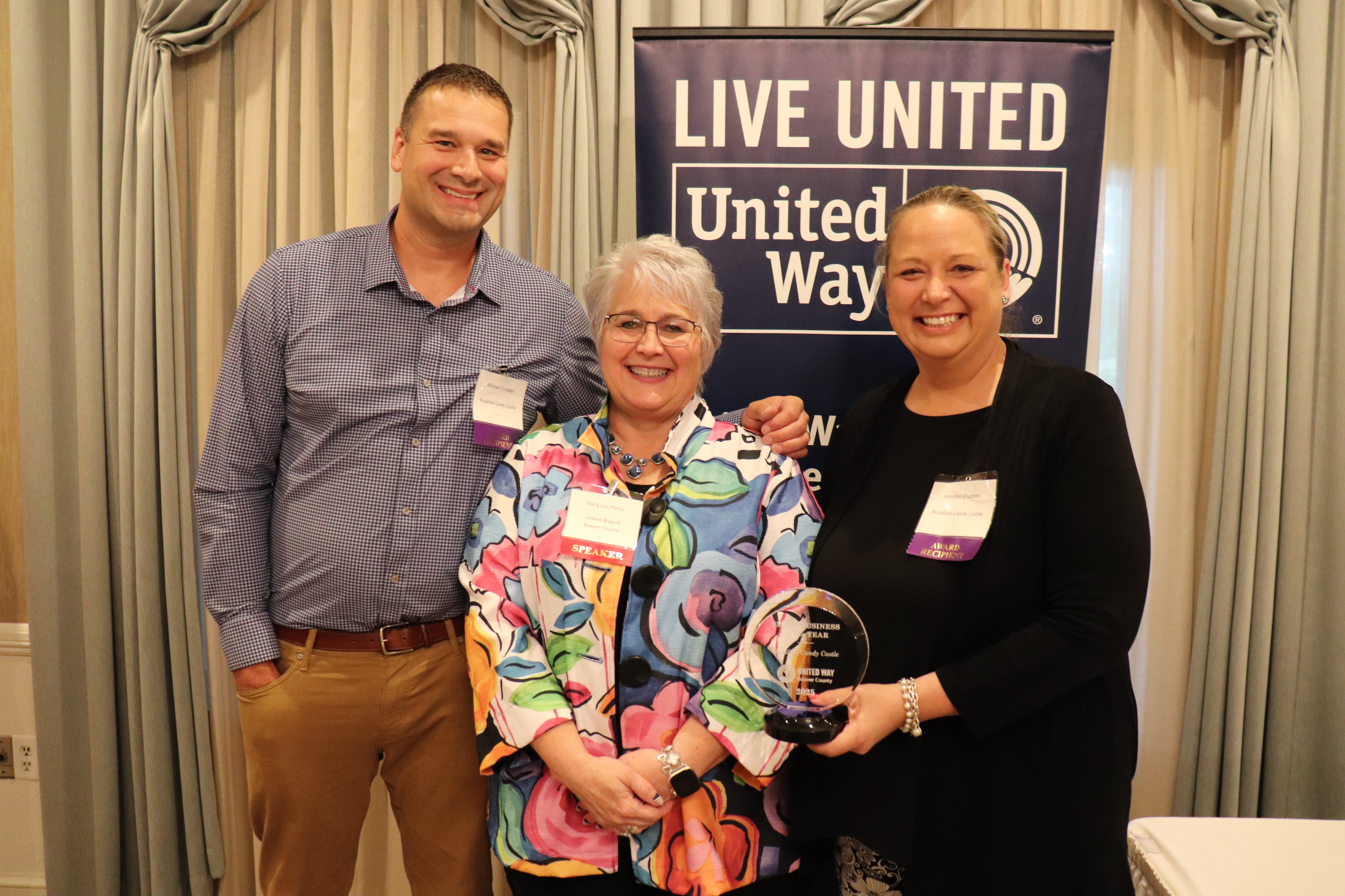 Jennifer and Michael Crudden accepting the Small Business of the Year Award for Rosalind Candy Castle