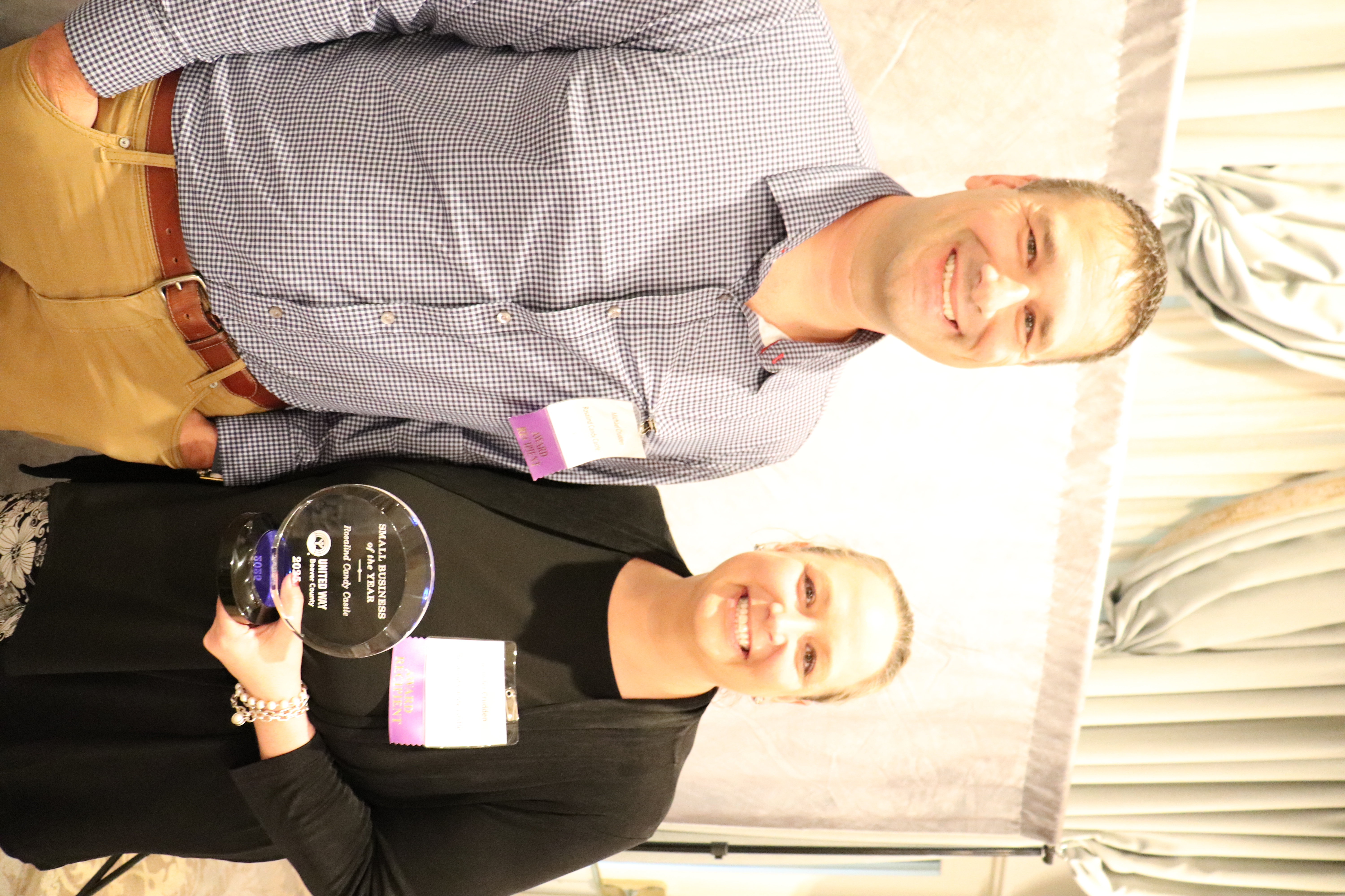 Jennifer and Michael Crudden accepting the Small Business of the Year Award for Rosalind Candy Castle