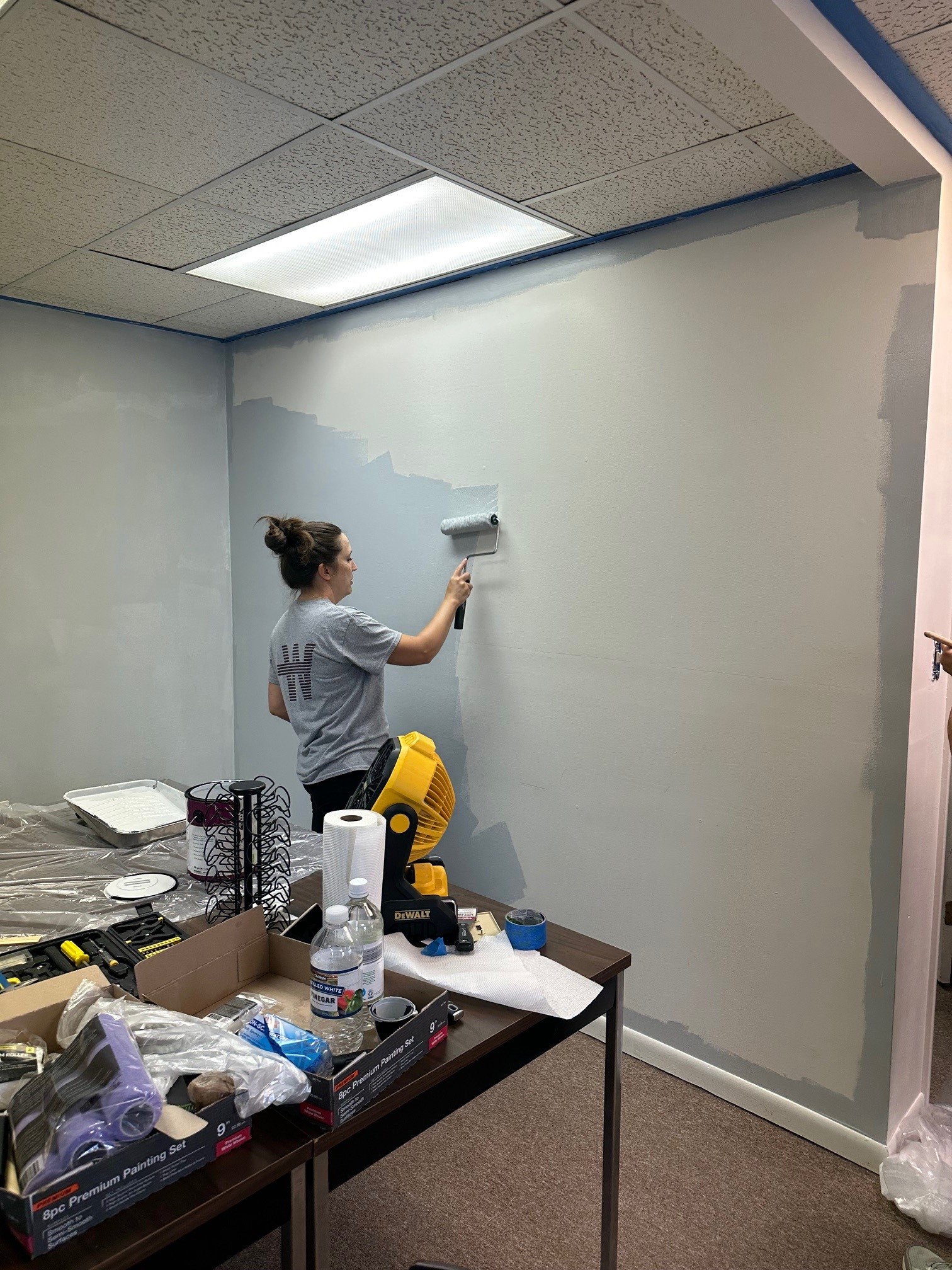 A volunteer painting