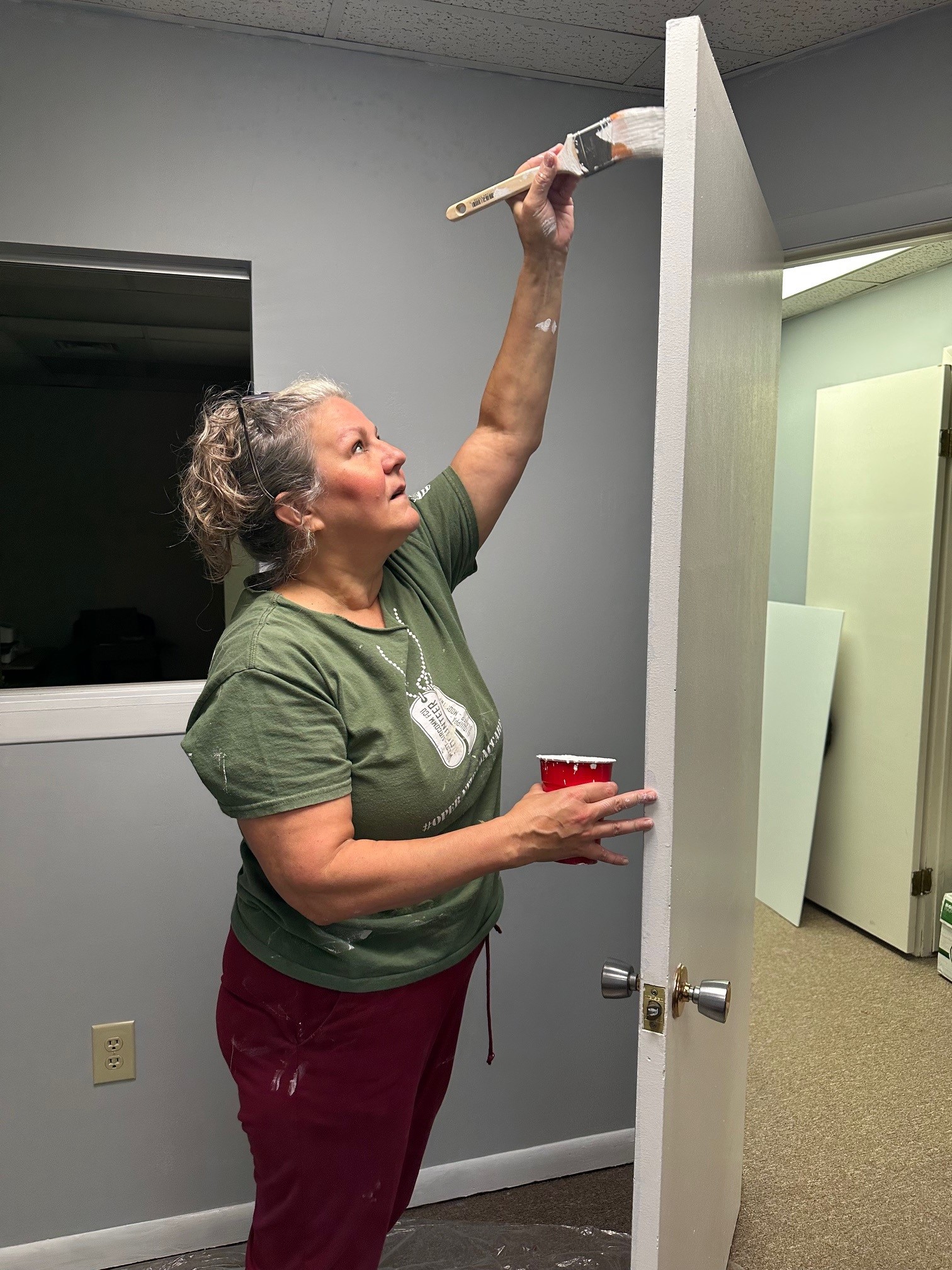 A volunteer painting