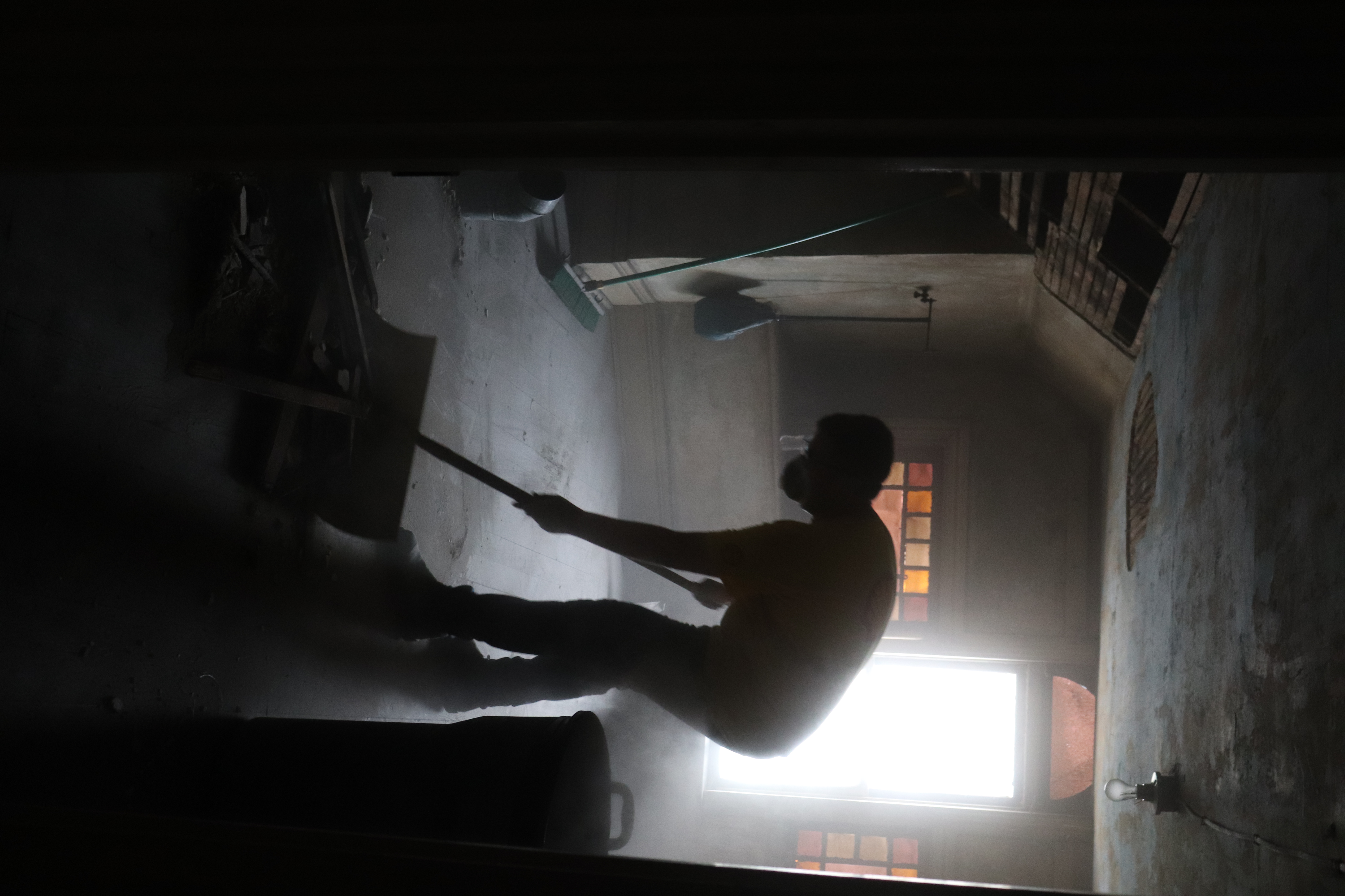 A volunteer cleaning up