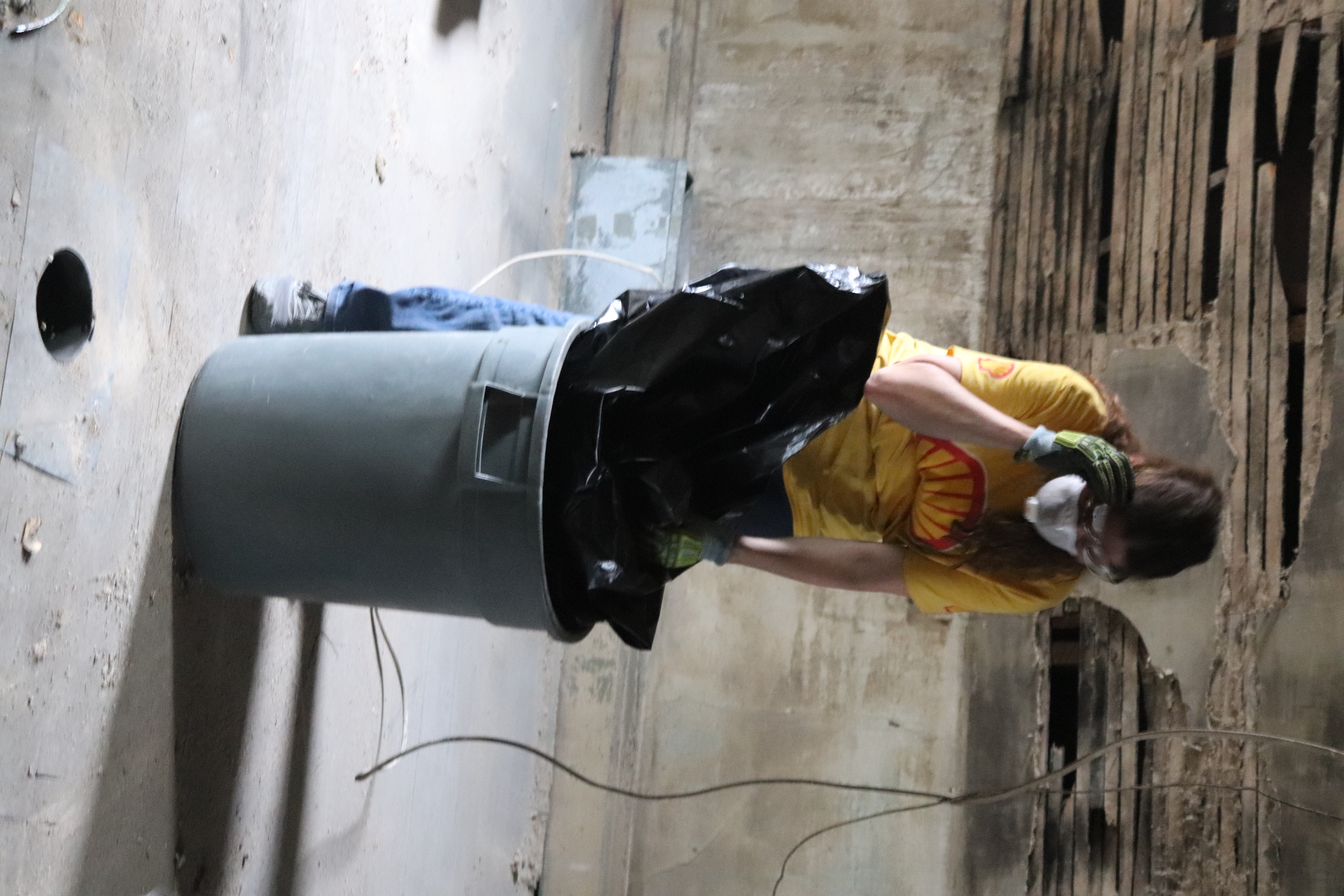 A volunteer cleaning up