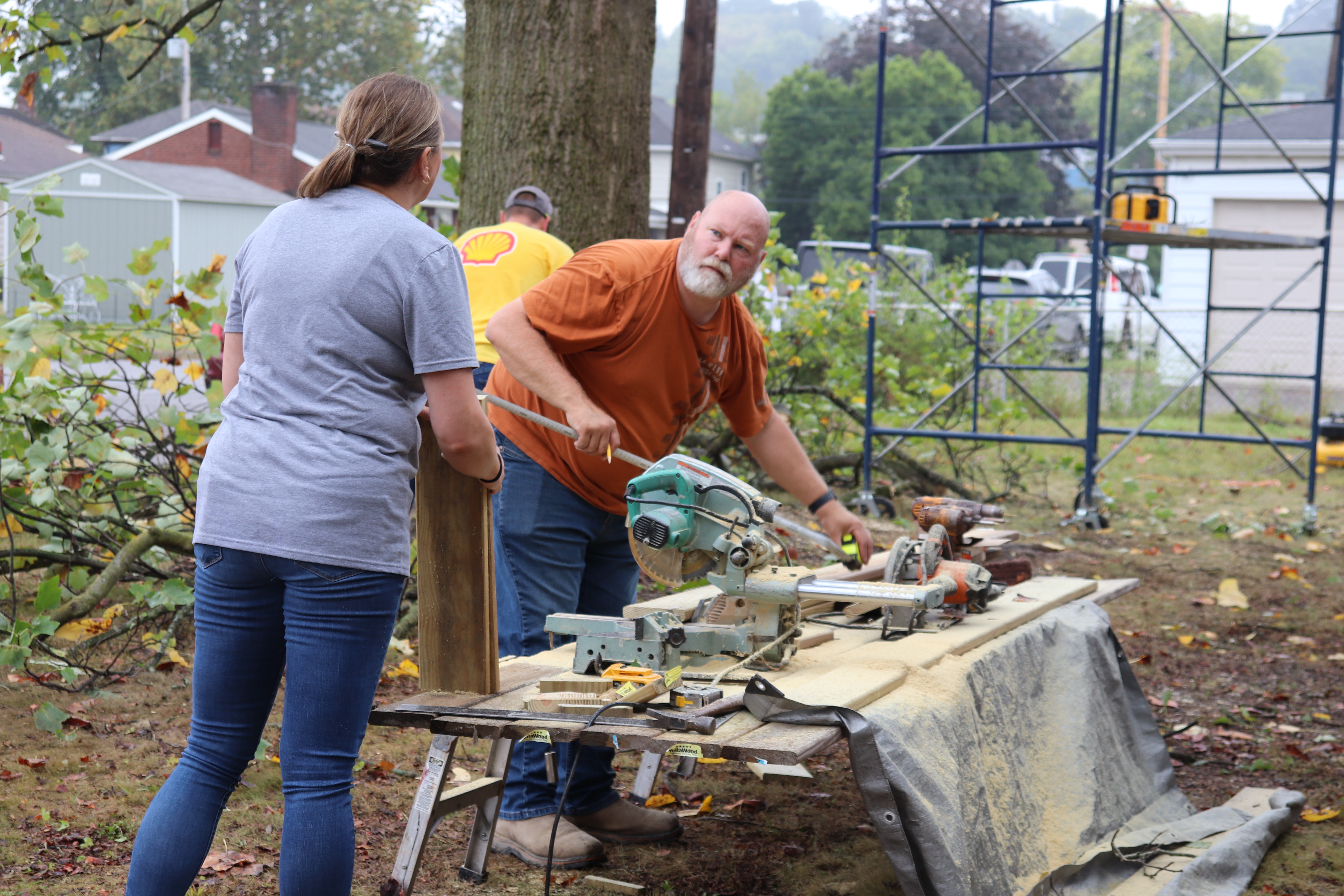 Volunteers chainsawing