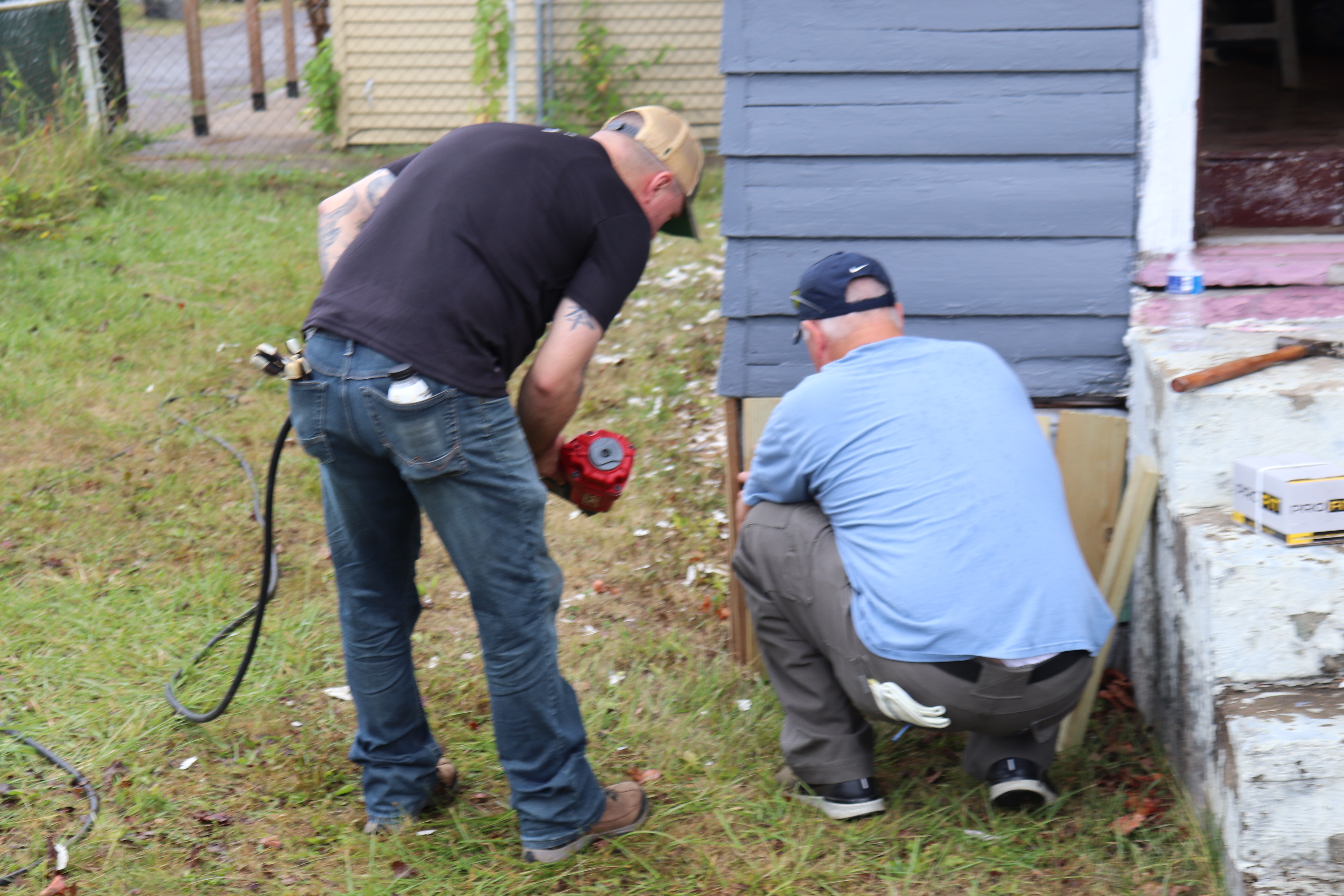 Volunteers working on a building