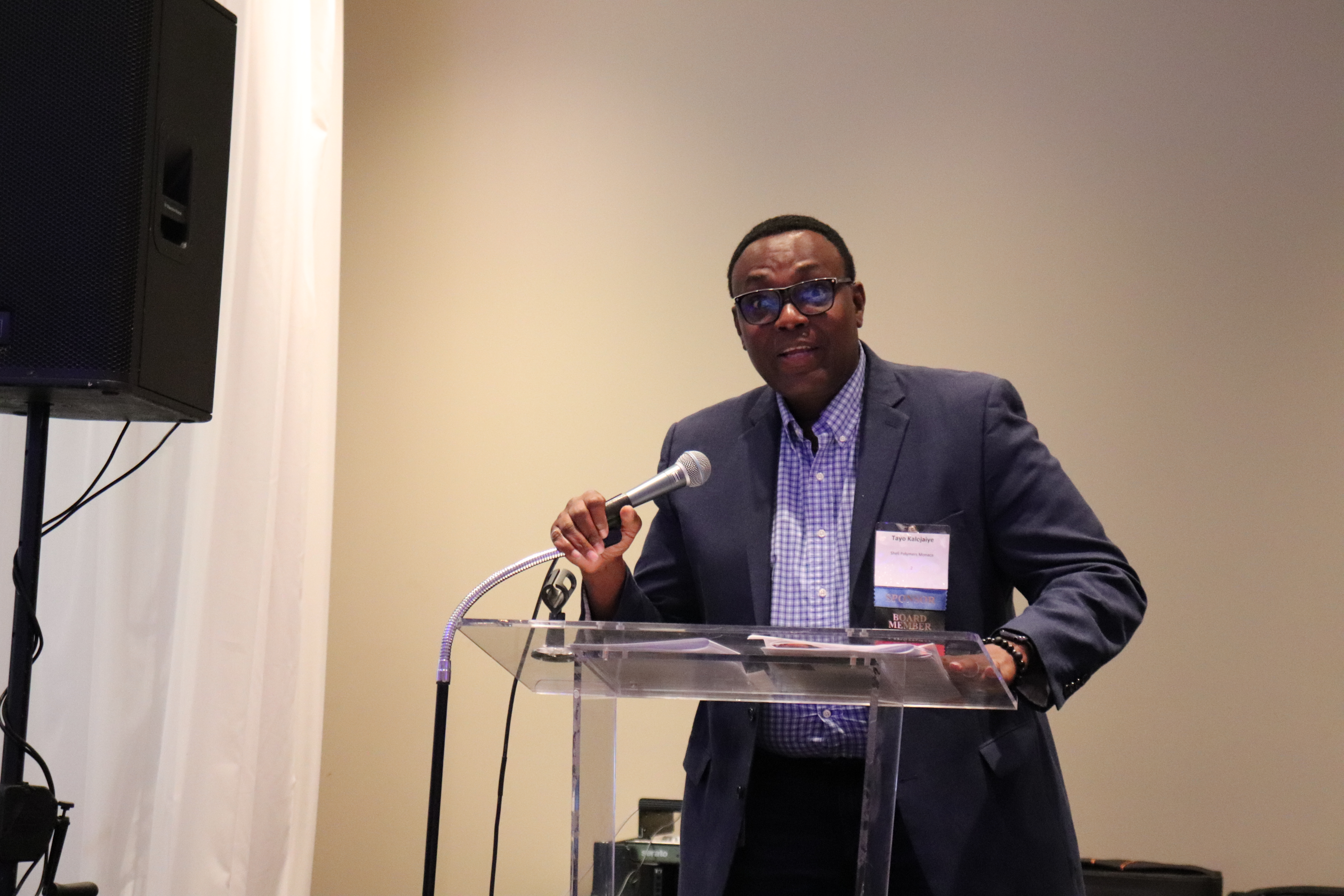 Board member Tayo Kalejaiye speaking