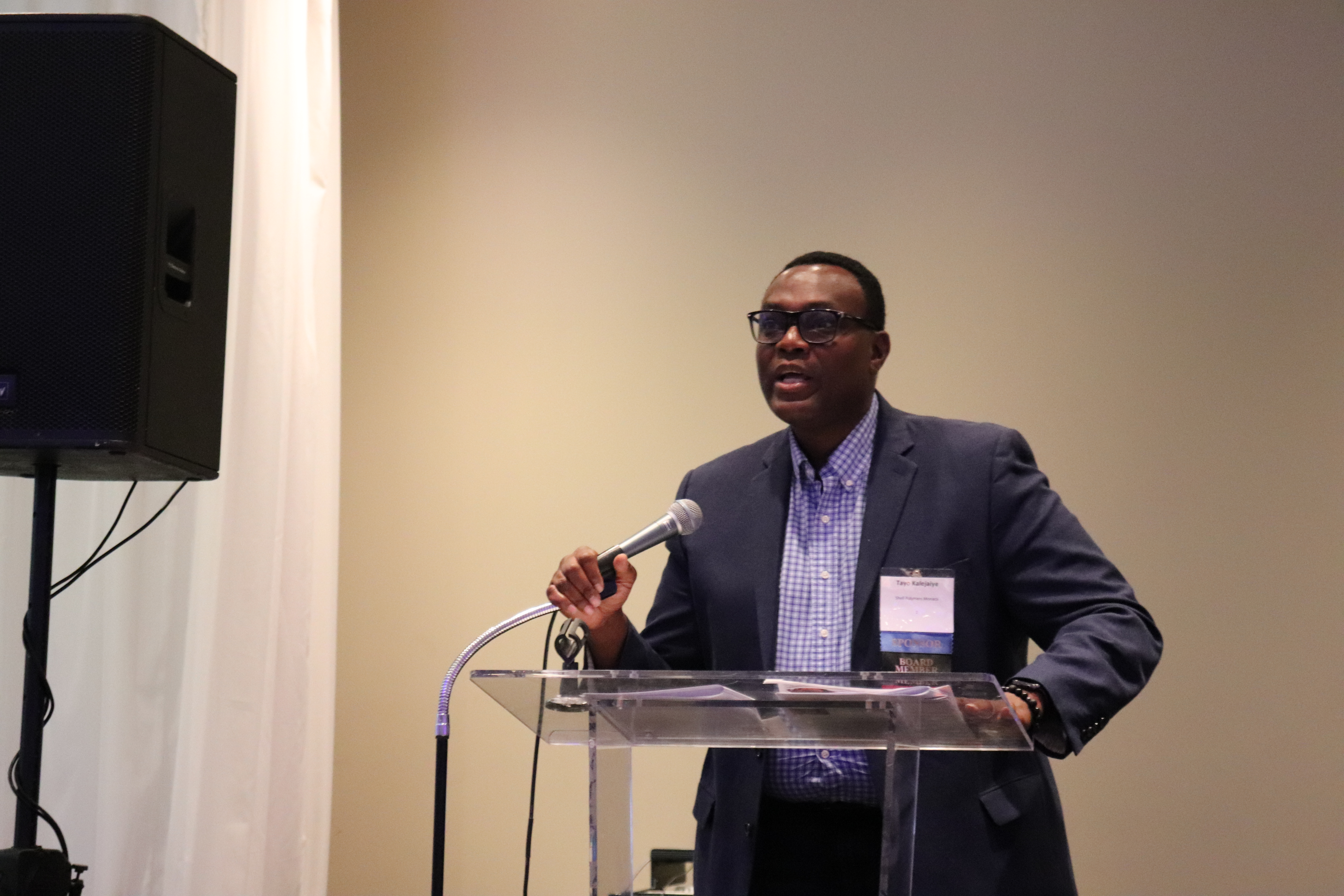 Board member Tayo Kalejaiye speaking