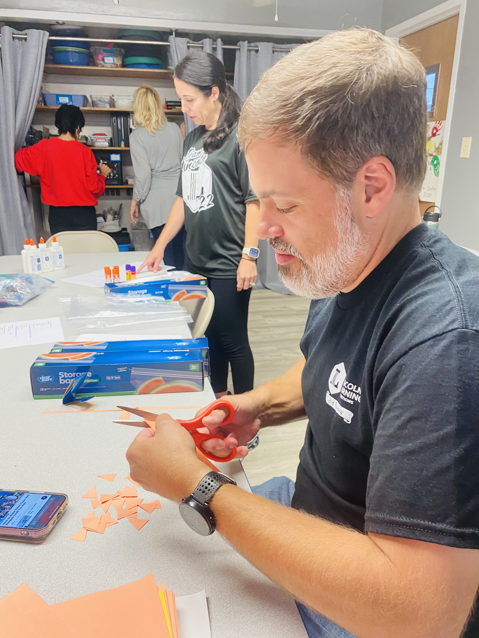 A volunteer prepping crafts