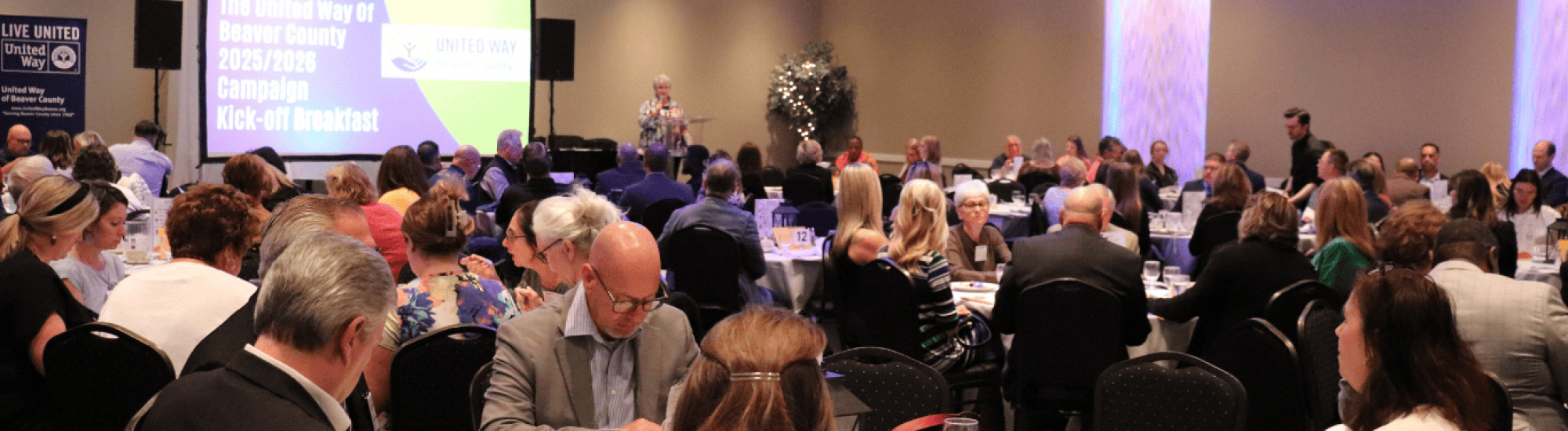 Kick-off BReakfast guests listening to Executive Director, MAry Lou Harju, speak. 