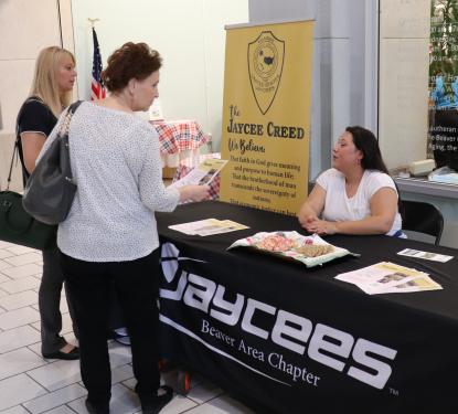 A person visiting the Jaycees' Table